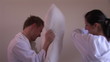 Video: Young couple fighting with pillows in their bedroom on waking Young couple fighting with pillows in their bedroom on waking