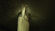 Close up of a stalactite lighting up in a cave