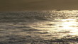 Beautiful view from the beach of the waves at sunset