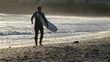 Video: Surfers with wetsuit and surfboard walking by the water Surfers with wetsuit and surfboard walking by the water