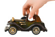 Hand and toy retro car