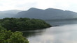 Video: Peaceful lake surrounded by mountains and forest Peaceful lake surrounded by mountains and forest