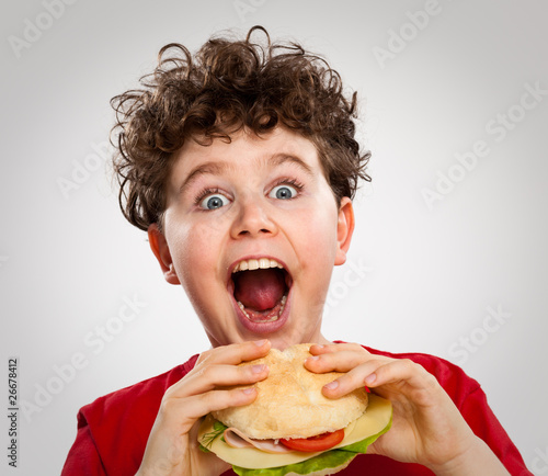 Photo: Boy eating big sandwich Boy eating big sandwich