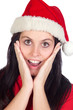 Surprised girl with Christmas hat