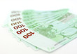 Euro in a hand isolated on white