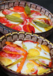 Stew with cheese, eggs, tomato and peppers.