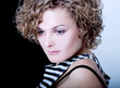 Curly-haired girl in a stripped top