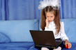 hard day in learning - girl with laptop and red apple in sofa hard day in learning - girl with laptop and red apple in sofa