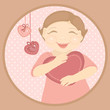 happy baby holding heart-shaped pillow in hands