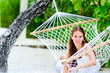 cheerful girl relaxing in hammock cheerful girl relaxing in hammock