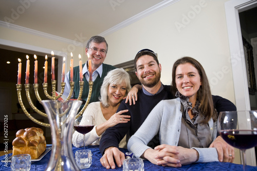 Photo: Jewish family celebrating Chanukah Jewish family celebrating Chanukah