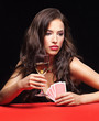 Foto: pretty young woman gambling on red table pretty young woman gambling on red table