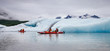 Young loving couple kayaking in Valdez glacialm lake, Alaska, US