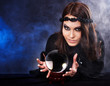 Young woman with crystal ball. Young woman with crystal ball.