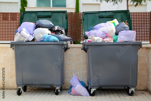 Photo: Trash garbage full container in street Trash garbage full container in street