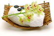 flower and  massage stone on towel isolated
