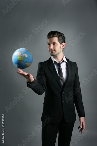 Photo: World globe map sphere in businessman hand World globe map sphere in businessman hand