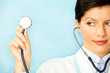 adult caucasian woman as a doctor holding stethoscope