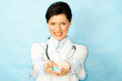 adult caucasian woman as a doctor holding meds