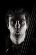 handsome musician making a kissing face at the viewe