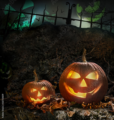Photo: Halloween pumpkins on rocks at night Halloween pumpkins on rocks at night