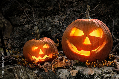 Photo: Halloween pumpkins on rocks at night Halloween pumpkins on rocks at night