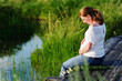 pregnant beautiful woman with hands over tummy pregnant beautiful woman with hands over tummy