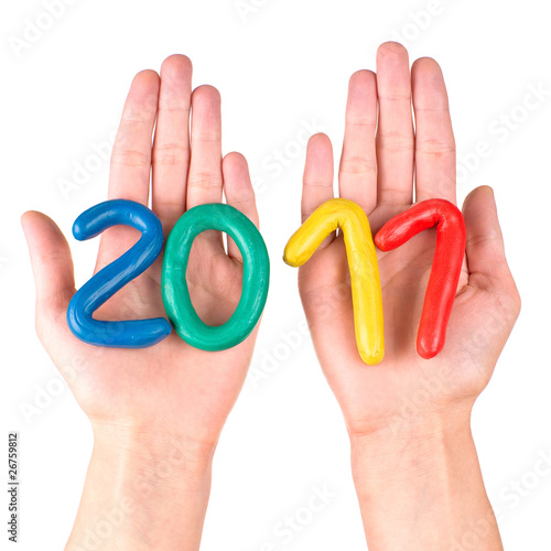 Photo: Hands with plasticine figures Hands with plasticine figures