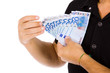 Man showing euro bills, studio shot