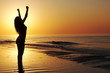 Woman showing achievement at the beach Woman showing achievement at the beach