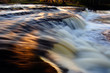 Sunset reflection on waterfall