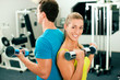Gym training with dumbbells
