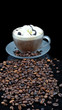 Pure glass with coffee with smoke and granules on black table