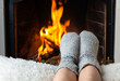 Children's feet are heated in the fireplace
