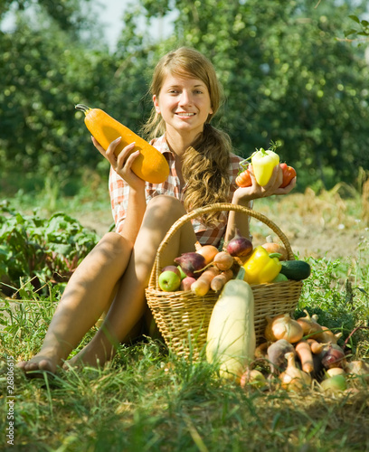 Photo: Happy girl with harvest Happy girl with harvest