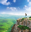 Girl on the peak of mountain