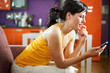 nervous woman holding cellphone