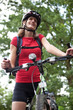 pretty young female biker outddors on her mountain bike (shallow