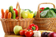 Composition with basket and vegetables on kitchen table Composition with basket and vegetables on kitchen table