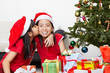 Sibling showing love in Christmas season Sibling showing love in Christmas season