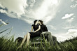 Photo: Young Couple Kissing on Old Car. Young Couple Kissing on Old Car.
