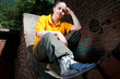Teenage hip-hop girl on red brick wall