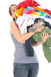 Photo: Young Woman with Pile of Washing. Model Released Young Woman with Pile of Washing. Model Released