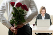 Photo: Excited and surprised businesswoman receiving red roses Excited and surprised businesswoman receiving red roses