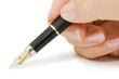 Fountain pen in hand isolated on white background
