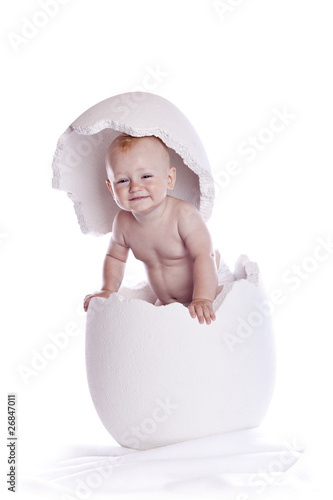 Photo: baby in egg on white baby in egg on white