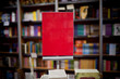 Red ad space in bookstore - many books in the background