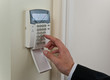 Businessman entering security code to pass Businessman entering security code to pass