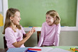 Photo: Friends in class talking Friends in class talking