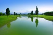 Golf course green grass field lake reflection